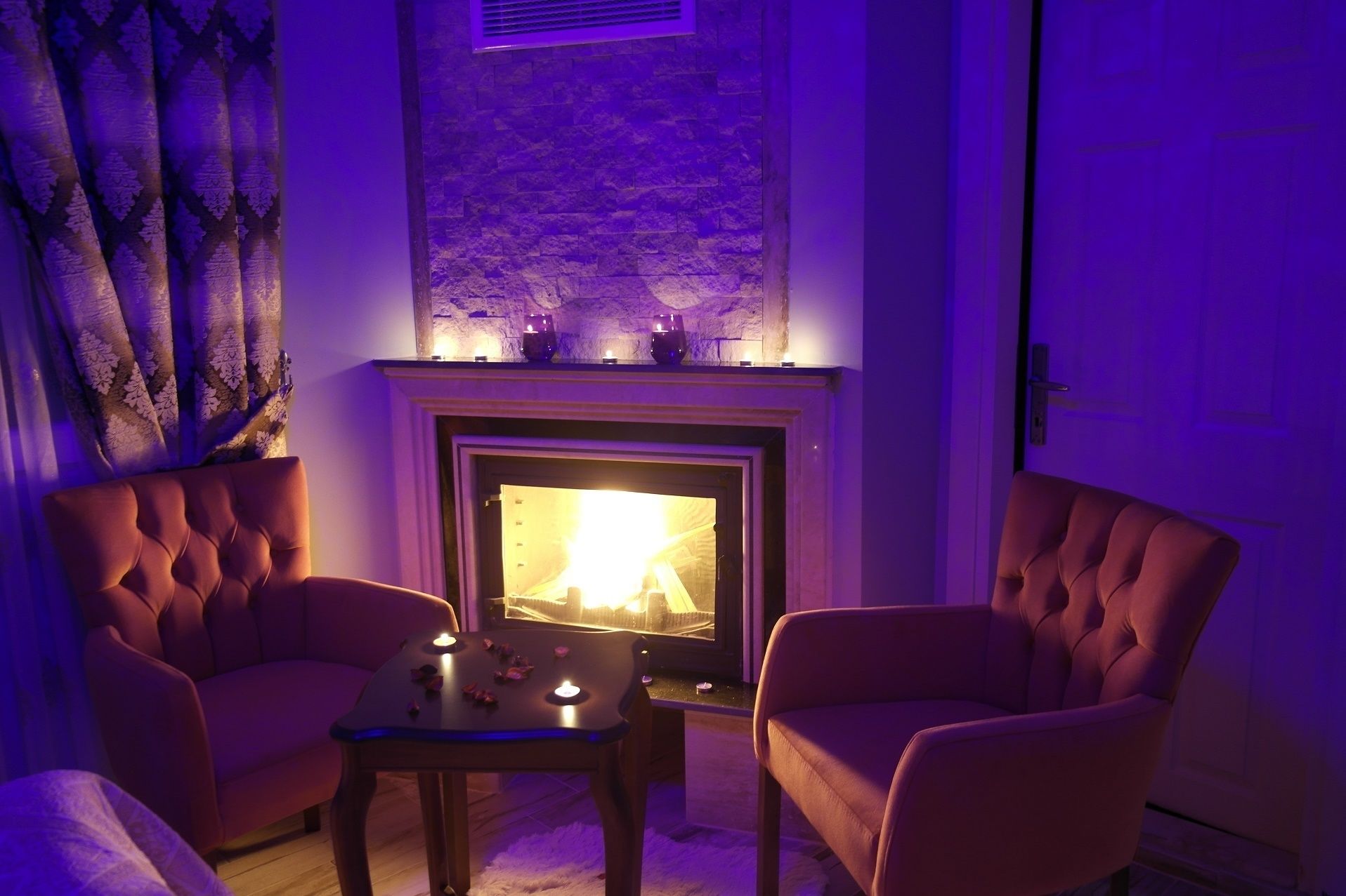 deluxe room, fireplace | living area | lcd tv