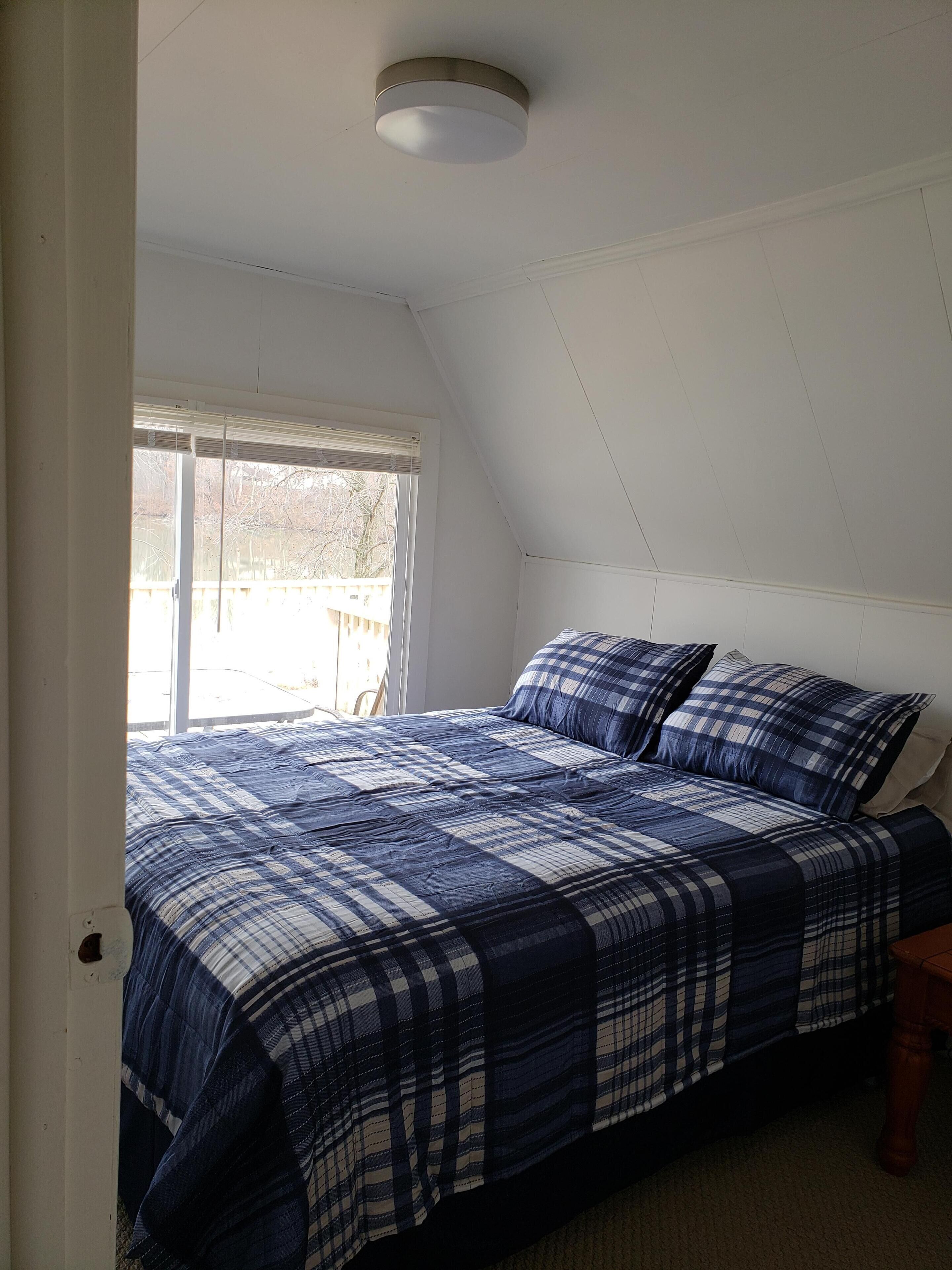 The Point is a waterfront rental with covered boat dock at Rocky Point Indiana