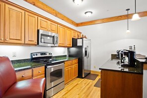 Dishwasher, coffee/tea maker, cookware/dishes/utensils, dining tables