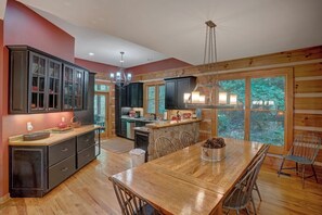 Dishwasher, coffee/tea maker, cookware/dishes/utensils, dining tables