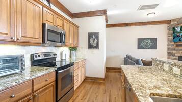 Dishwasher, coffee/tea maker, cookware/dishes/utensils, dining tables