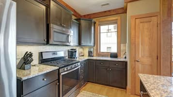 Dishwasher, coffee/tea maker, cookware/dishes/utensils, dining tables