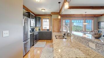 Dishwasher, coffee/tea maker, cookware/dishes/utensils, dining tables