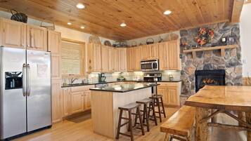 Dishwasher, coffee/tea maker, cookware/dishes/utensils, dining tables