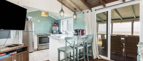 Fridge, dishwasher, coffee/tea maker, cookware/dishes/utensils