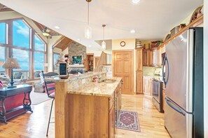 Dishwasher, coffee/tea maker, cookware/dishes/utensils, dining tables