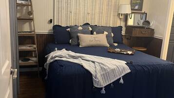 1 bedroom, desk, iron/ironing board, travel crib