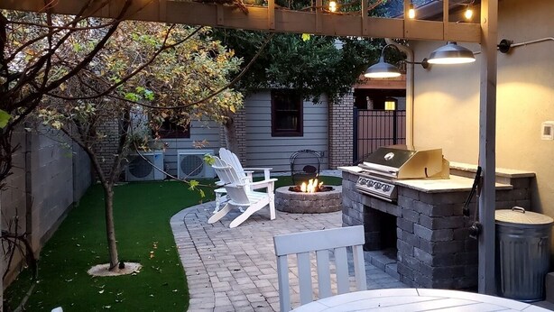 A backyard with a grill, fire pit, outdoor seating, and a small tree. - 1927 Restored Downtown Phx Historic Bungalow close to Medical & Sports. (Phoenix)