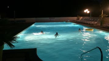 Seasonal outdoor pool, open 9:00 AM to 10:30 PM, pool umbrellas