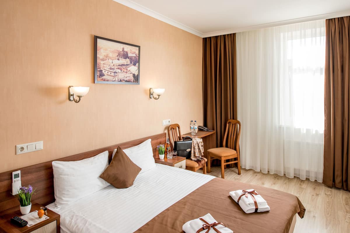 Comfort Double Room | Desk, laptop workspace, blackout drapes, iron/ironing board (on request)