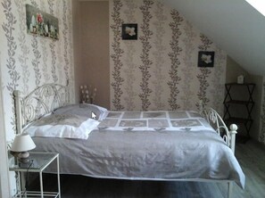 Triple Room (Taupe) | Individually decorated, individually furnished, blackout drapes