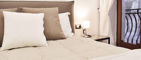 Deluxe Quadruple Room | Premium bedding, desk, blackout drapes, soundproofing