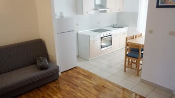 Apartemen, pemandangan laut (A2) | Area keluarga | Smart TV