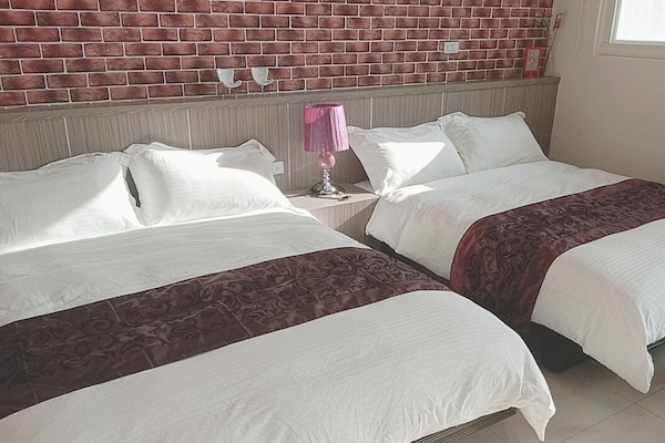 Standard Quadruple Room | Down comforters, desk, blackout drapes, free WiFi
