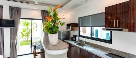 Fridge, microwave, stovetop, coffee/tea maker