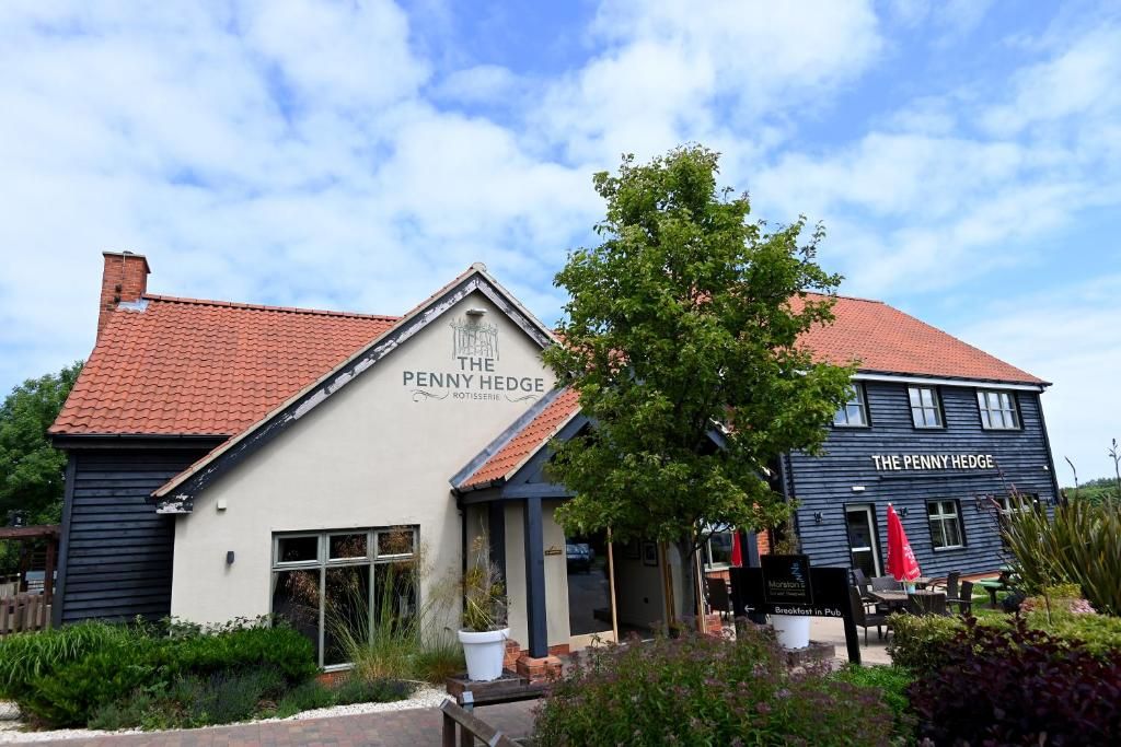 A building with the sign 'The Penny Hedge' indicating a pub or restaurant.