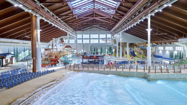 An indoor water park with slides, a wave pool, and seating areas. - Great Wolf Lodge Arizona (Scottsdale)