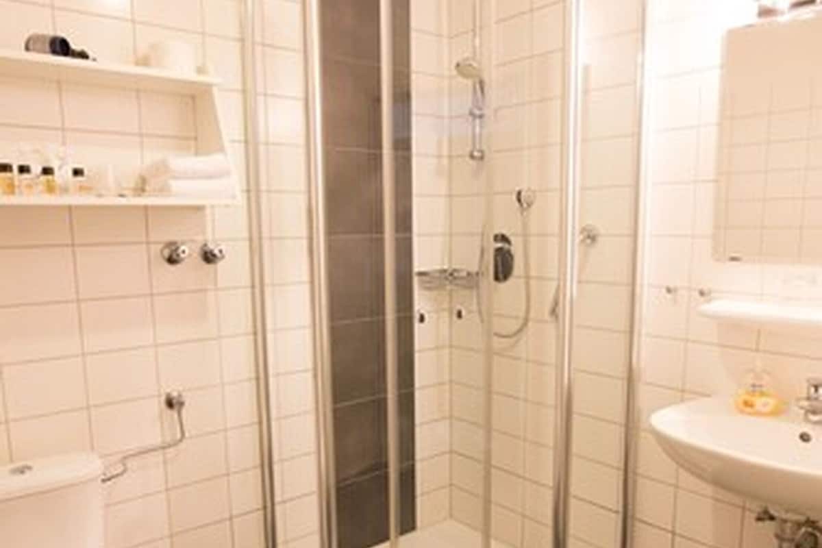 shower, eco-friendly toiletries, towels