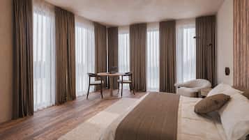 Une chambre d’hôtel avec un lit, un bureau et une chaise, ainsi qu’un canapé.