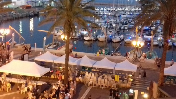 A marina with boats docked, people gathered around, and tents set up for an event. - Studio, 4px, great view of the marina, 66750 St Cyprien beach. 250 € week (Saint-Cyprien)