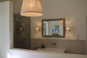 Shower, hair dryer, towels, toilet paper