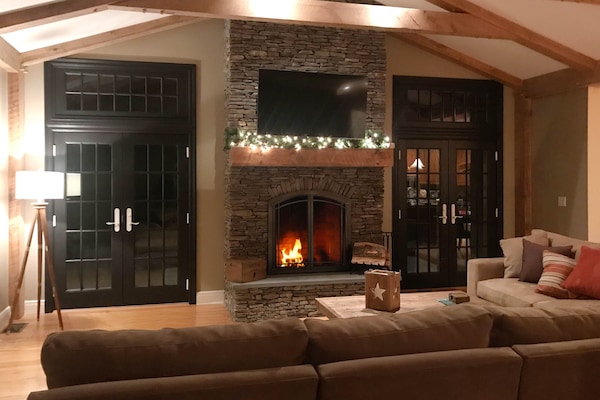 Stacked-stone fireplace and french doors.