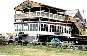 Enjoy a view of the surrounding area from the upper-level balcony at the Tiki Bar.