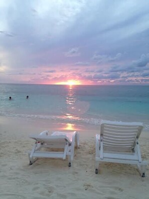 On the beach, sun loungers, beach towels