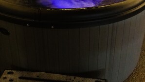 A hot tub with a blue light effect.