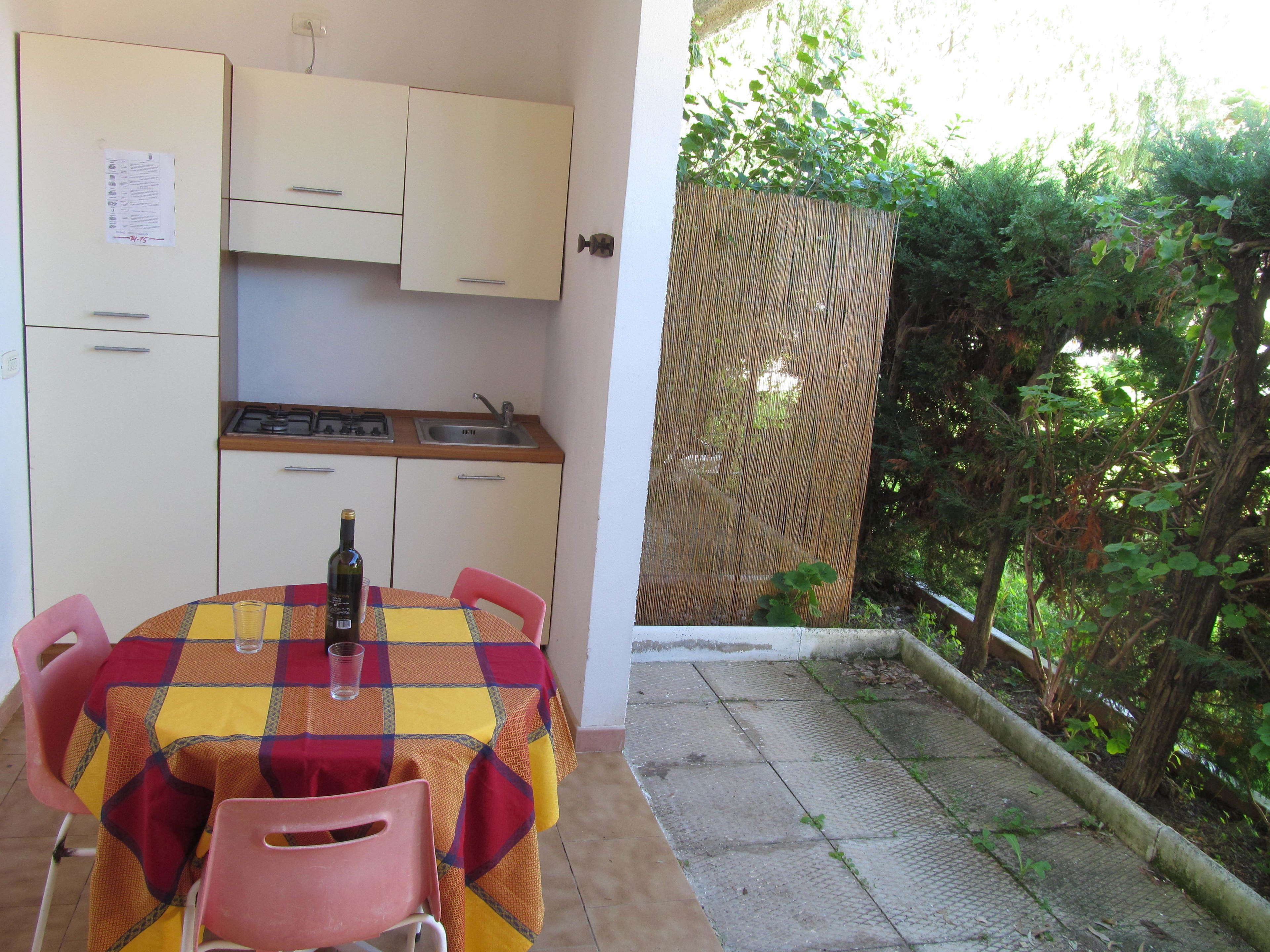 Full-sized fridge, stovetop, cookware/dishes/utensils