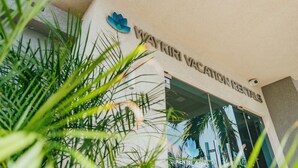 A building entrance with a sign reading "WAYKIRI VACCINATION RENTALS".