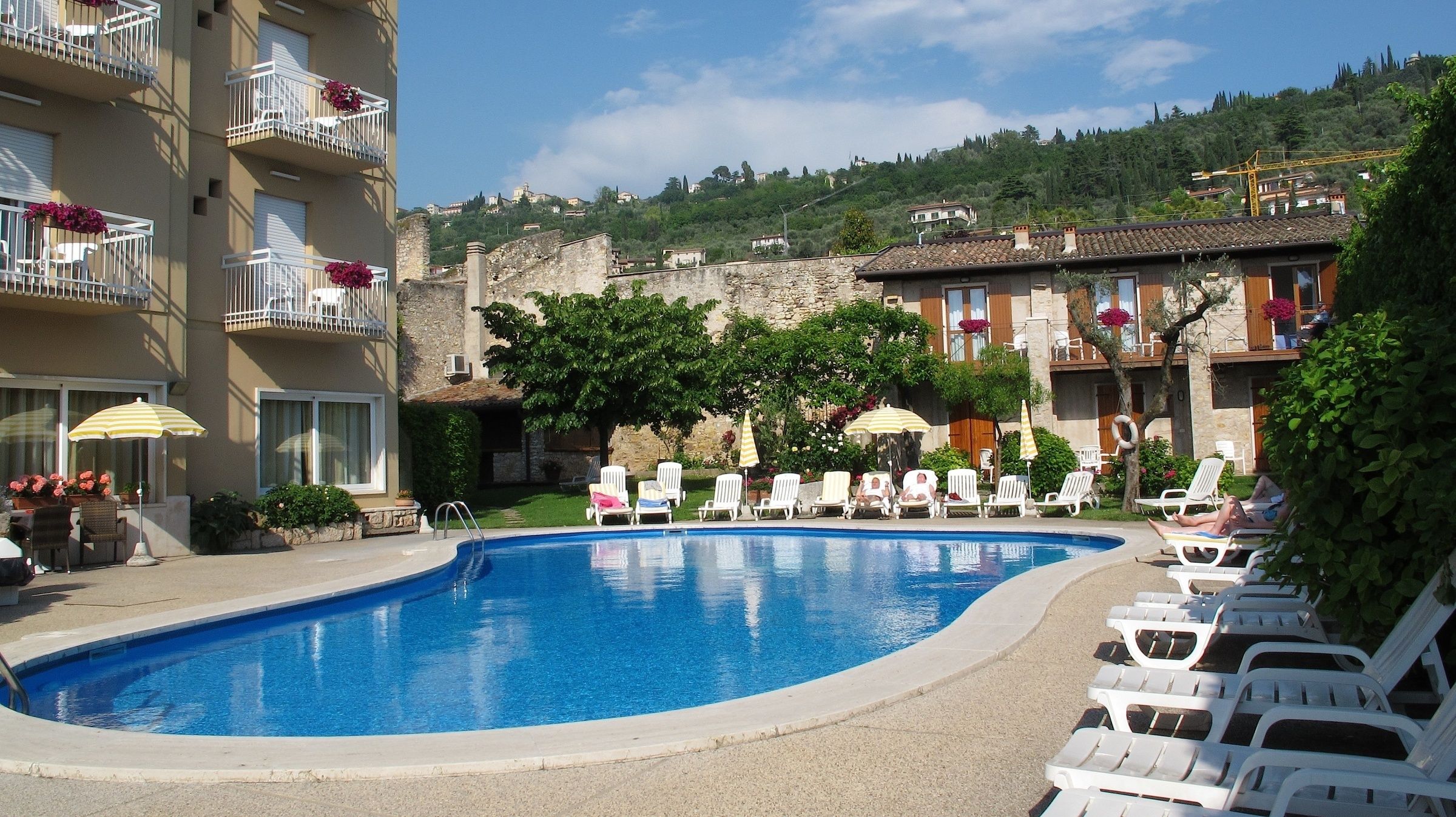 seasonal outdoor pool, pool umbrellas, pool loungers