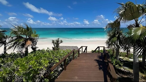 A wooden pathway leading to a beach with clear turquoise water and a clear sky. - Monticello, Desert Rose beachfront cottage,Tiki Hut & Generator,10% Off 7+nights (governors harbour)