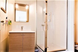 Shower, hair dryer, towels, soap