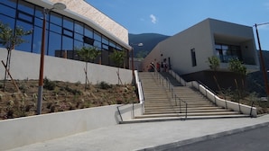 A modern building with a staircase leading to a second floor. - Gites de Mon Clocher 2 apartments in a village house (Alpes-Maritimes)