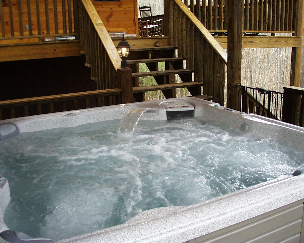 Large covered waterfall hot tub 