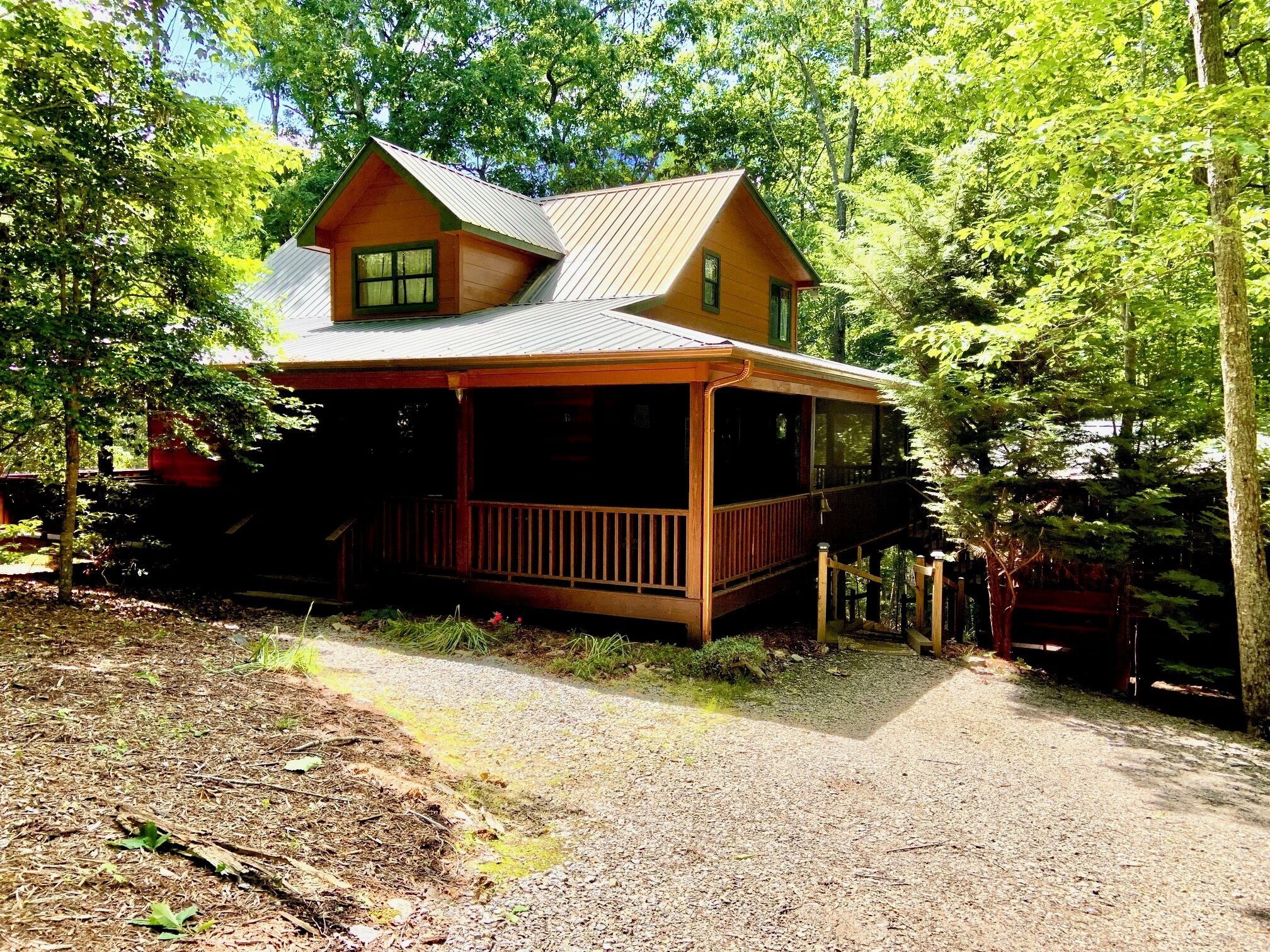  Set back off a deadend road on 3 acres in a cabin community.