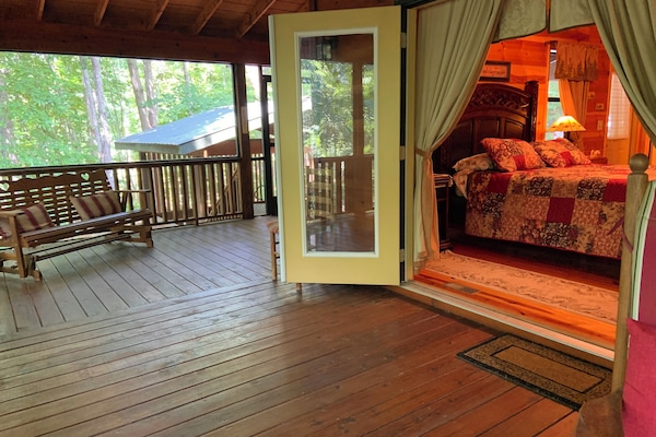 Large porches, hot tub gazebo in background