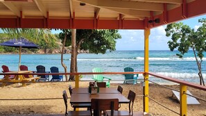 Outdoor dining - REMODELED 2026! Prime OCEANFRONT POOLSIDE 2BR/2BA Condo-BEST location+Generator (St Thomas)