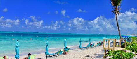 On the beach, sun loungers, beach towels