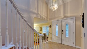 A staircase with white balusters leading to a landing. - Family Fun, Pickleball, Pool/Spa, Water slide (Las Vegas)