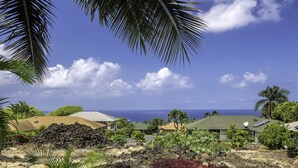 A tropical resort with multiple buildings, lush greenery, and a view of the ocean. - Hale Alaula - Ocean View: Private Home Near Kona Town w/Spa, AC, Spacious Lanai (Kailua Kona)