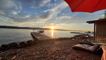 Watching the sun go down over the dock from our beach