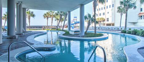 Enjoy the lazy river with the whole family at The Oasis in Orange Beach, with a view of the beach and fun water slide nearby