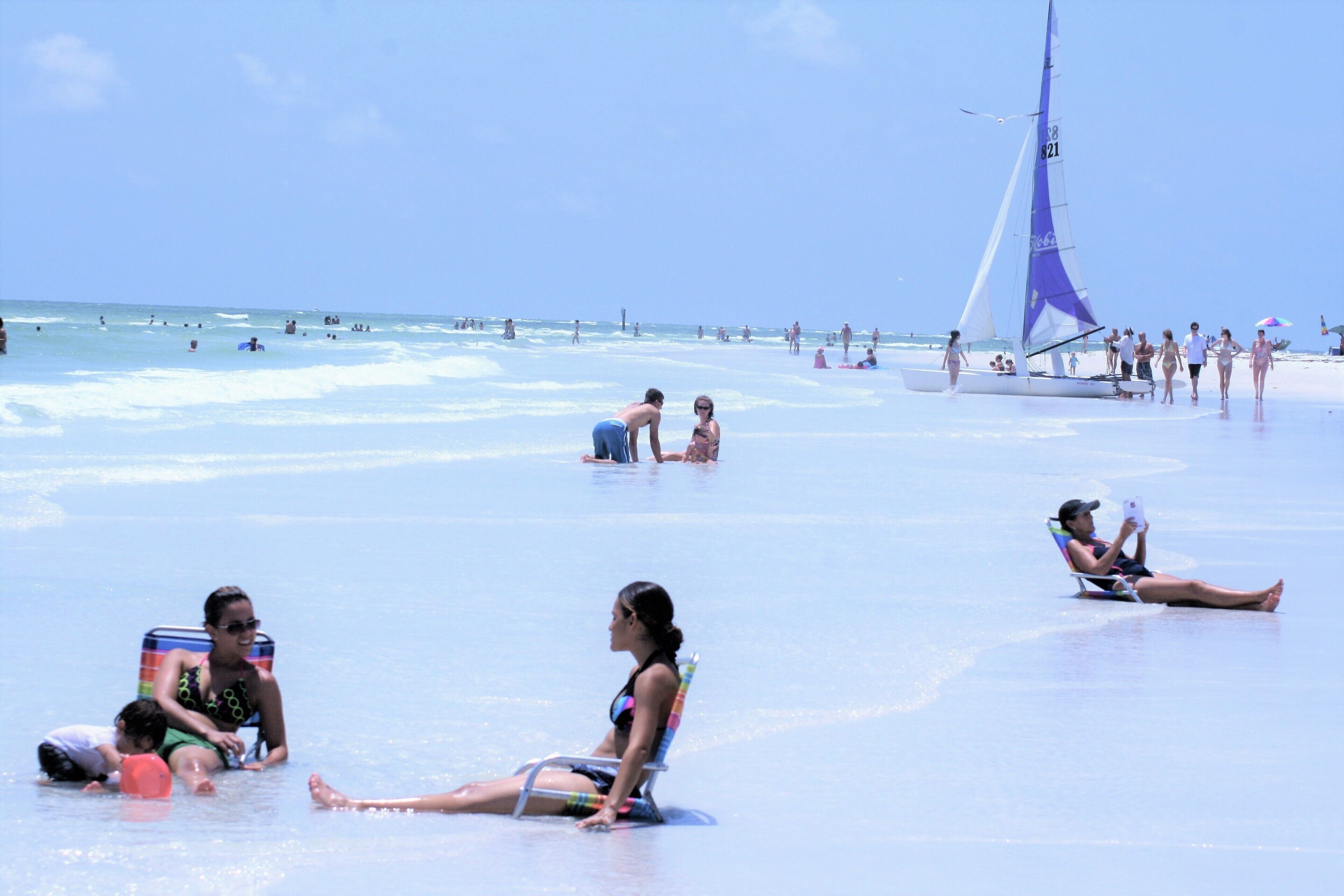 On the beach, sun loungers, beach towels