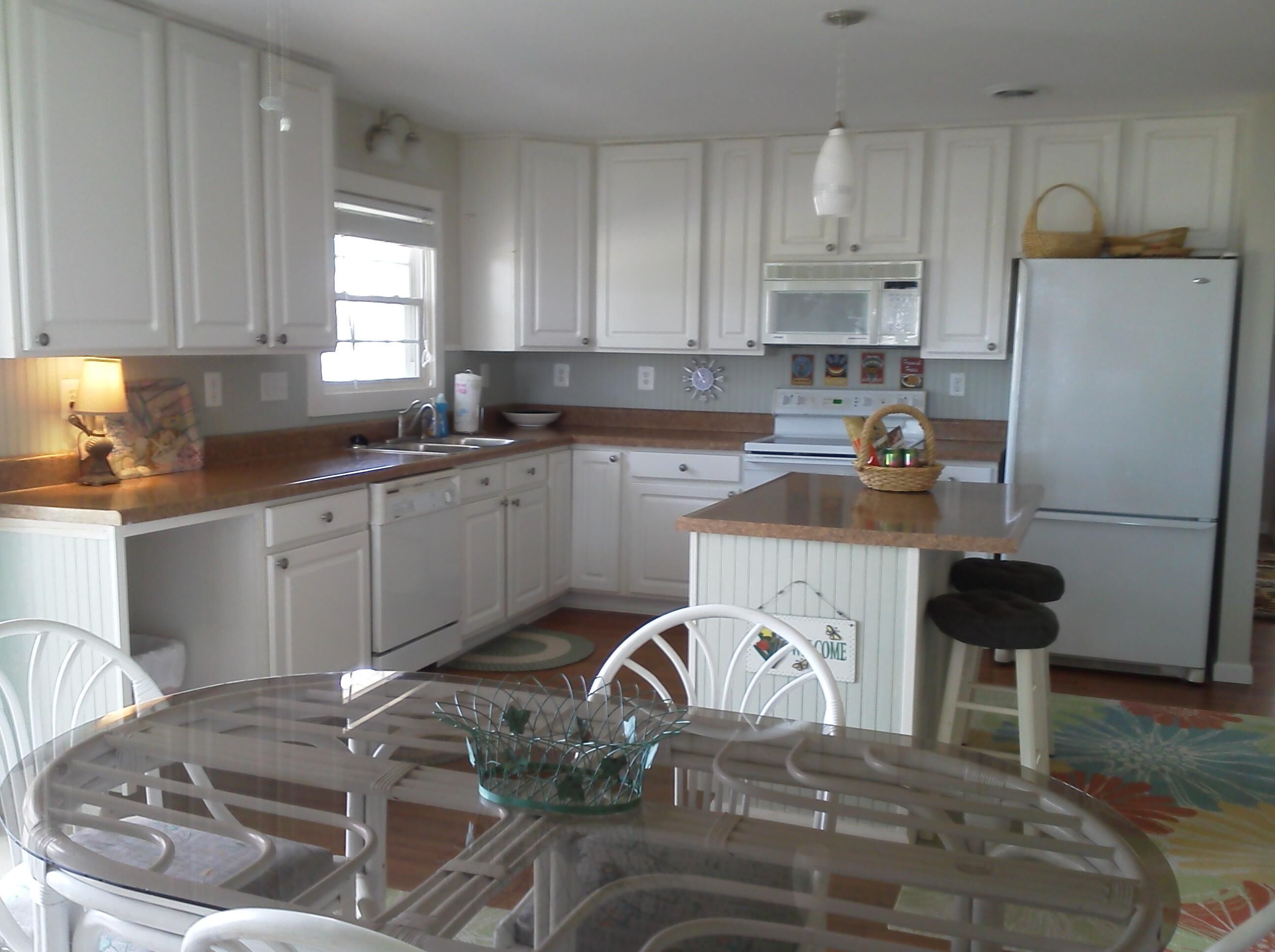 Great kitchen with views of the river and easy access to outside grill