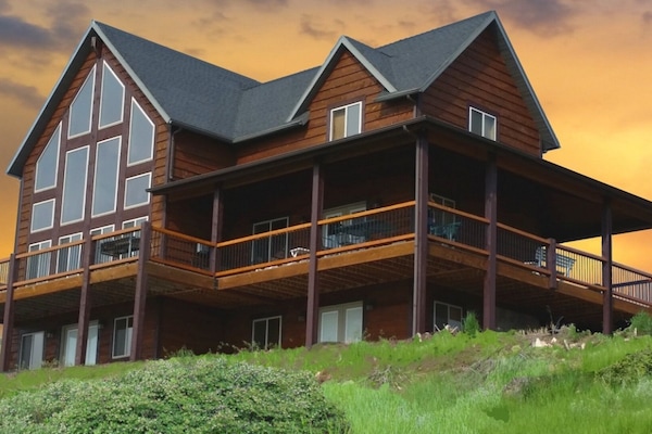 Cabin Exterior - Deck View. Cabin on Hill over looking the lake.
