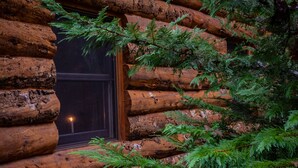 A log cabin with a window and a candle inside. - Private Engleman Spruce Cabin with Game Room, Community Pool & Car Charger (Blue Eye)