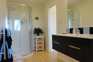 Shower, hair dryer, bathrobes, towels