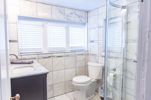 Combined shower/tub, hair dryer, towels, soap